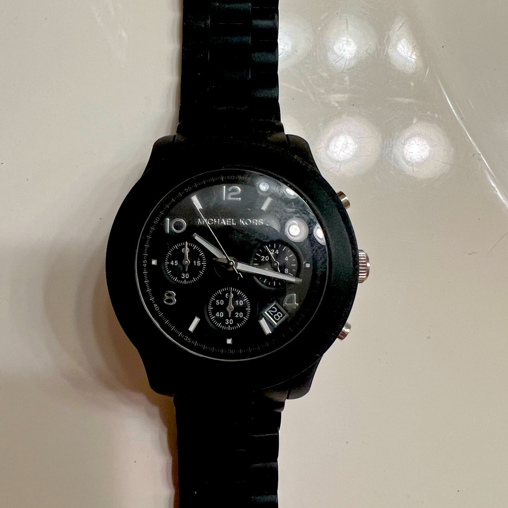 Michael Kors women’s watch in excellent condition. Rubber like band. Original